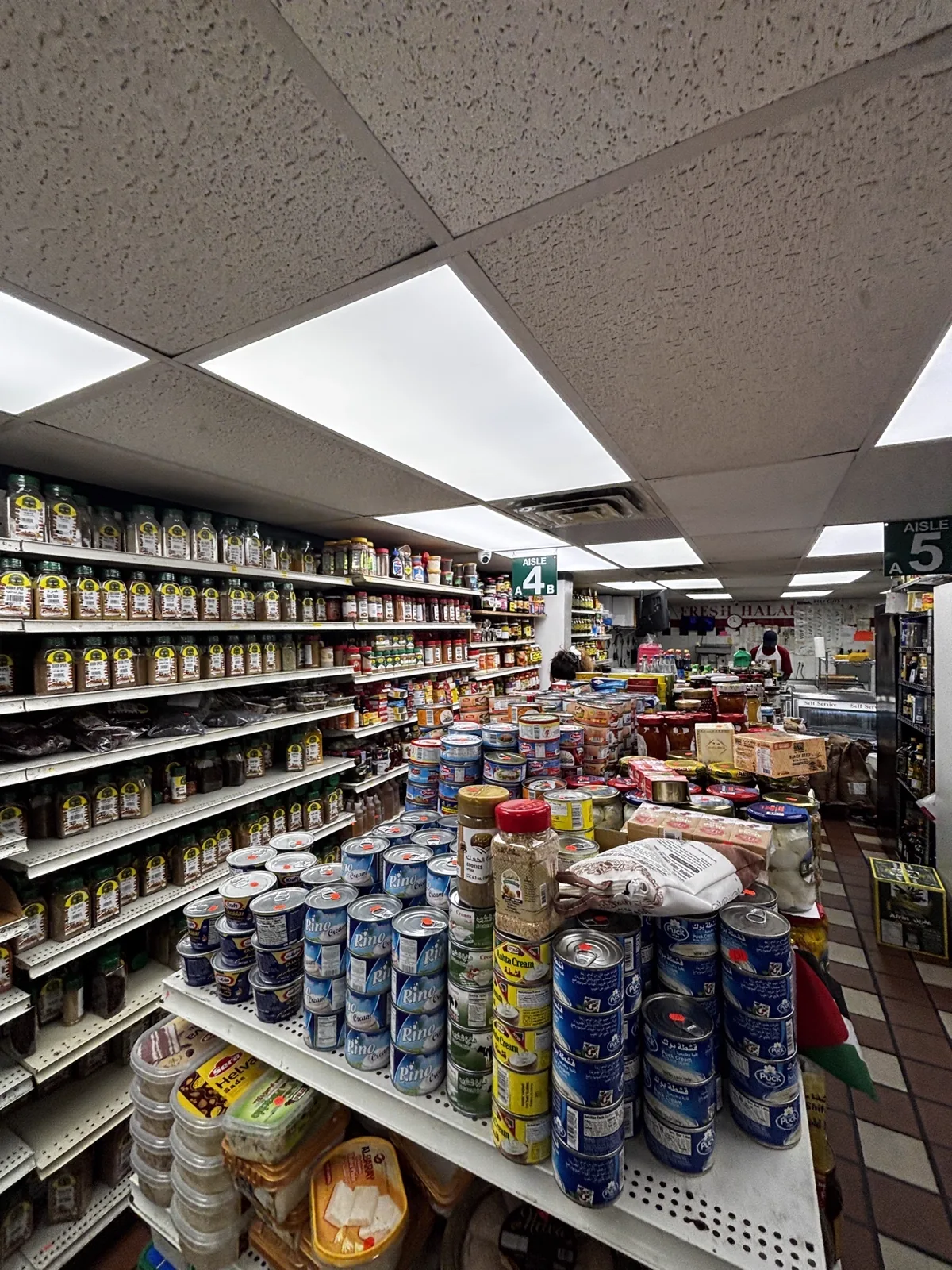 Aisle 4 and 5 — shelves of canned goods and pantry items