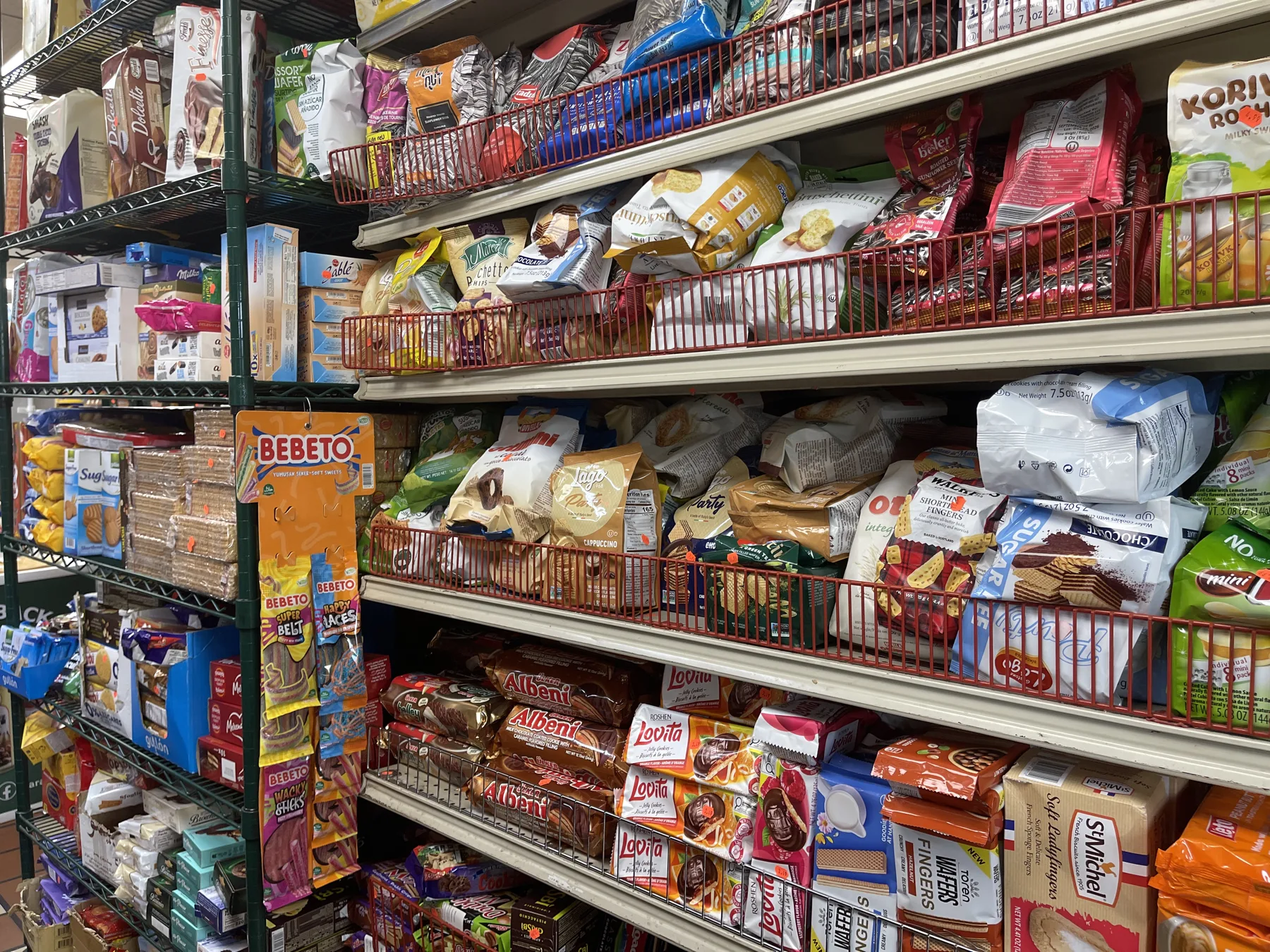 Sweets, biscuits and confections aisle — French wafers, Roshen, Albeni chocolates and Bebeto candies at Makkah Market