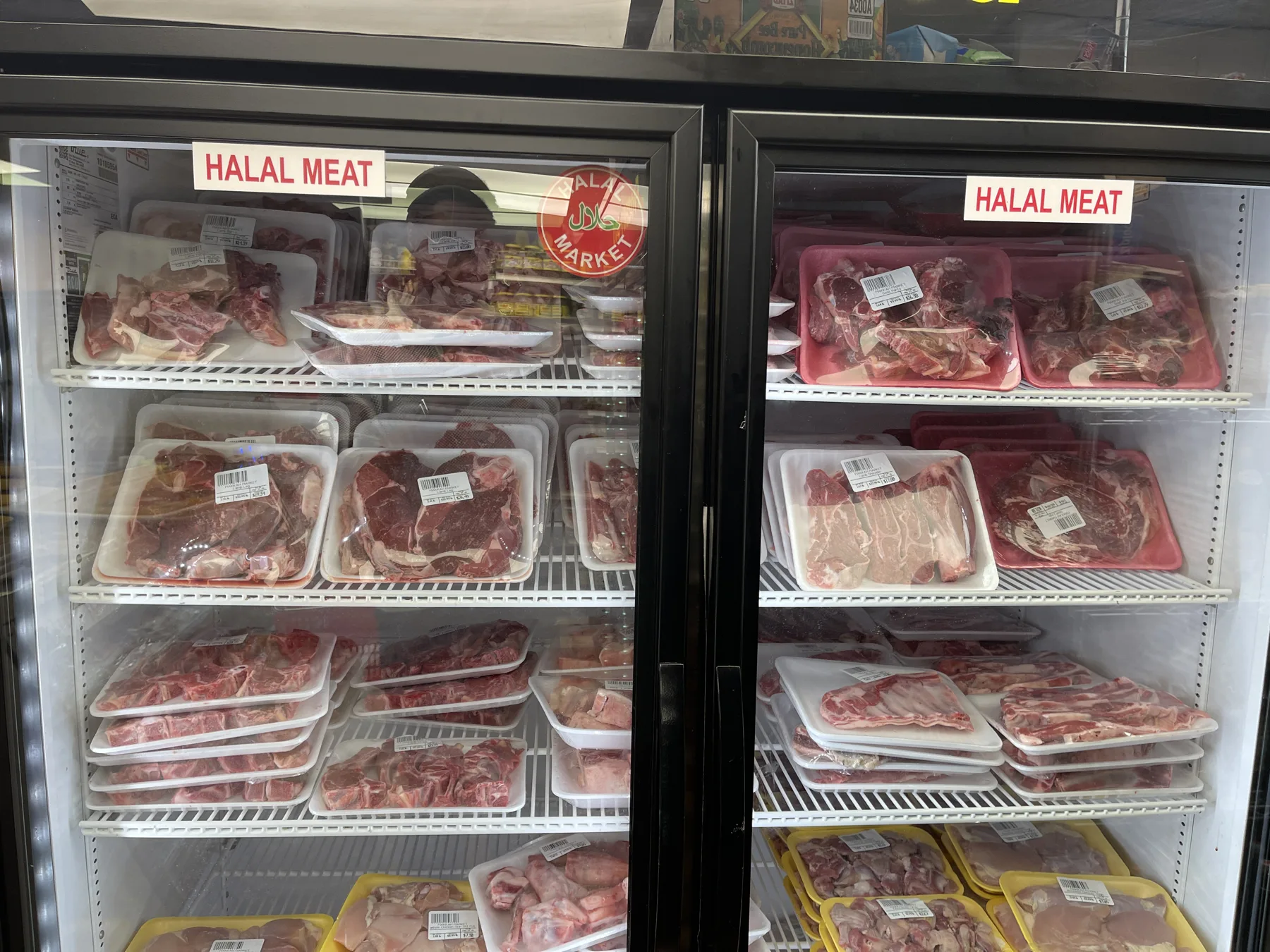 Halal meat case at Makkah Market — trays of lamb, goat and beef in West Philadelphia