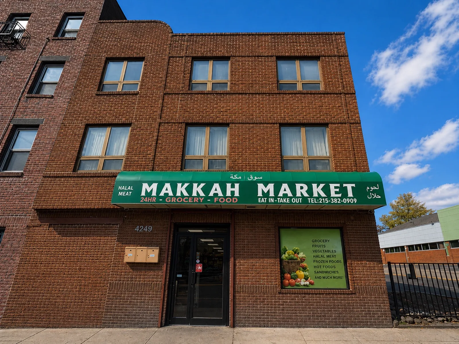 The Makkah Market storefront on Walnut Street with green awning and full sign