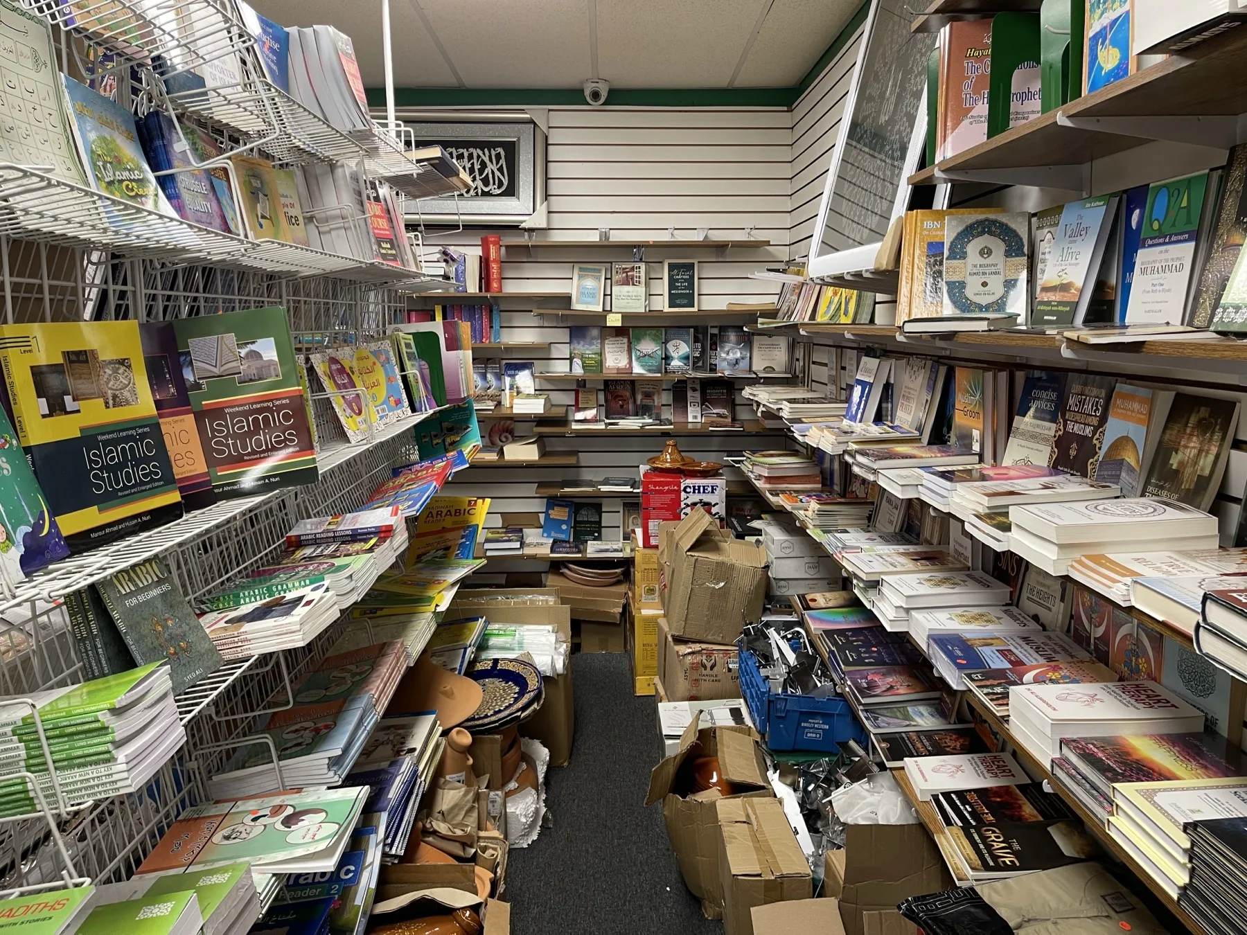 Islamic bookstore inside the upstairs bazaar at Makkah Market — Qurans, tafsir and Arabic learning books